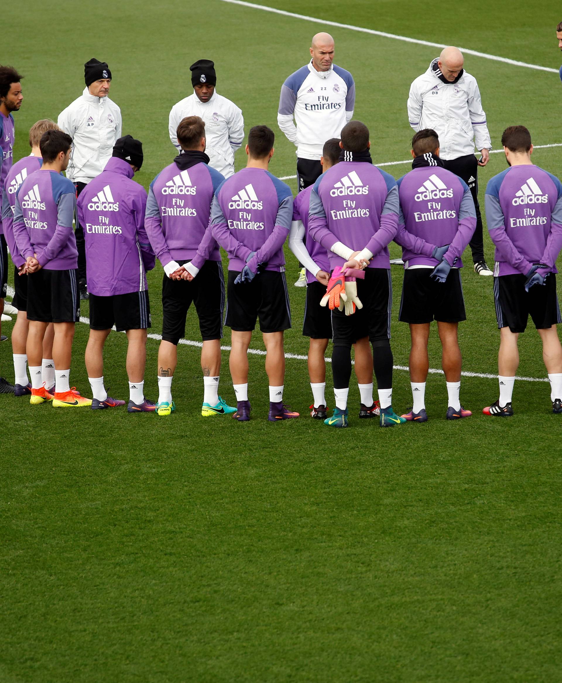 Real Madrid's players observe a minute of silence at Real Madrid's Valdebebas training ground outside Madrid