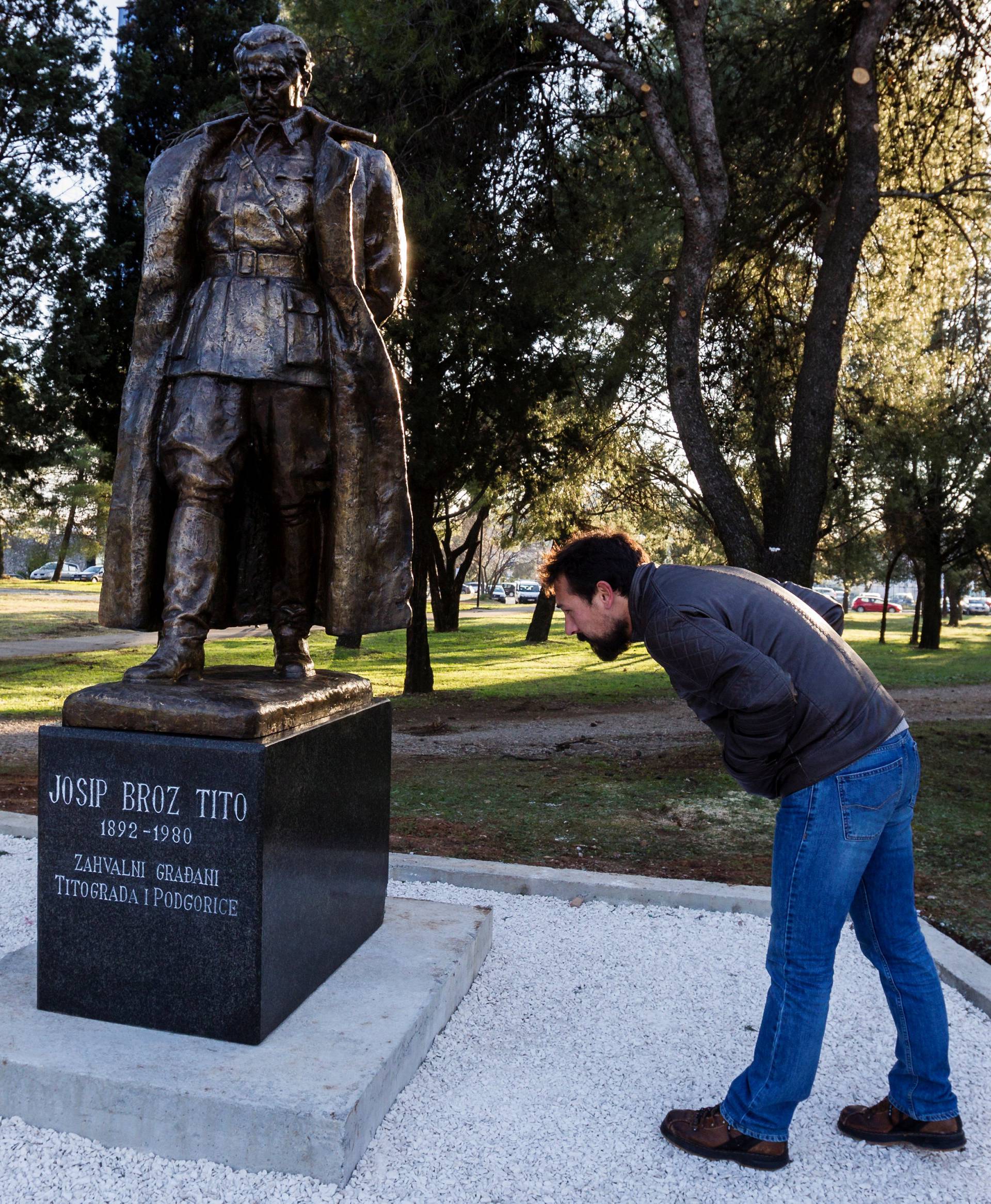 A man looks at the monument of late Yugoslav leader Josip Broz Tito in Podgorica