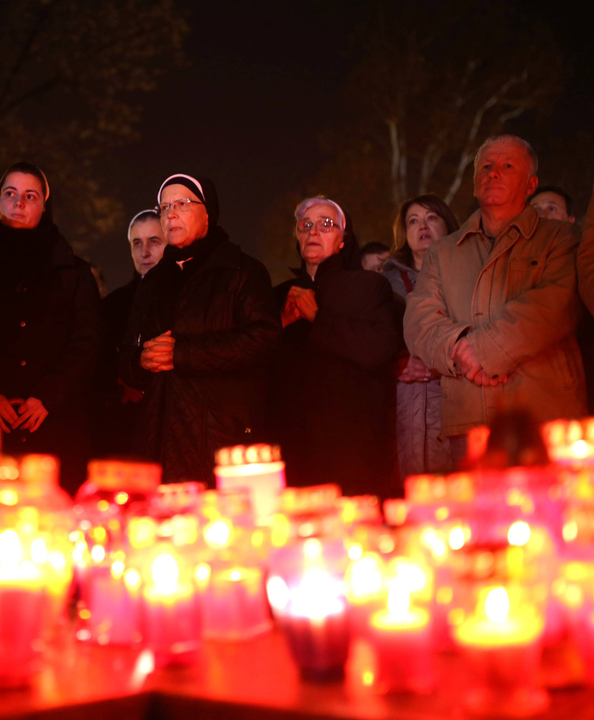 Bosnian Catholic nuns pray and light candles for the convicted general Slobodan Praljak, who killed himself seconds after the verdict in the U.N. war crimes tribunal in The Hague, in Mostar