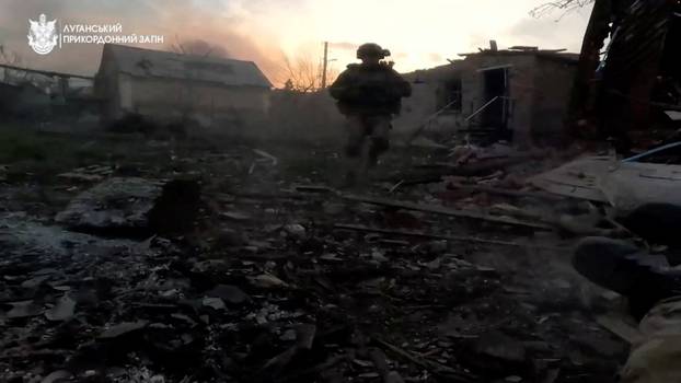 Ukrainian forces fight in besieged Bakhmut - border guard body camera