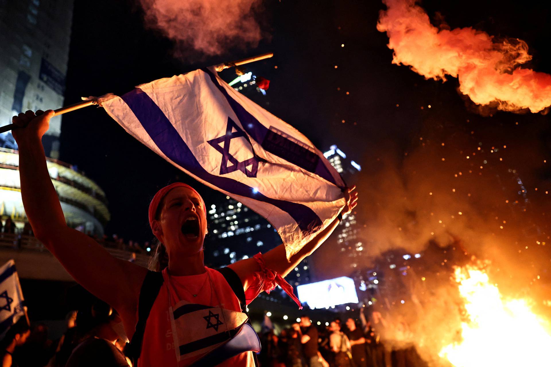 Israelis demonstrate after Israeli Prime Minister Benjamin Netanyahu sacked his defense minister, Yoav Gallant, in Tel Aviv