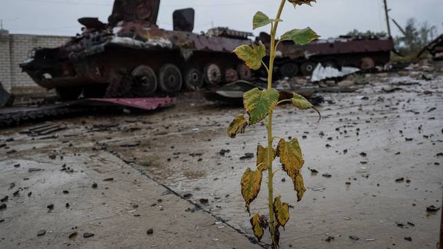 A destroyed Russian Armoured Personnel Carrier (APC) is seen near the village of Nova Husarivka