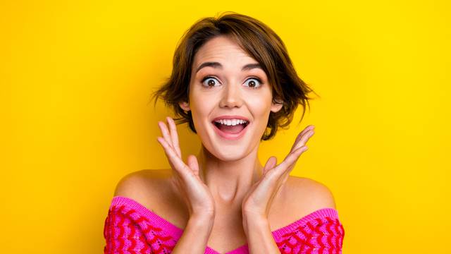 Photo of cute impressed girl bob hairstyle dressed off shoulder shirt staring at unexpected discount isolated on yellow color background