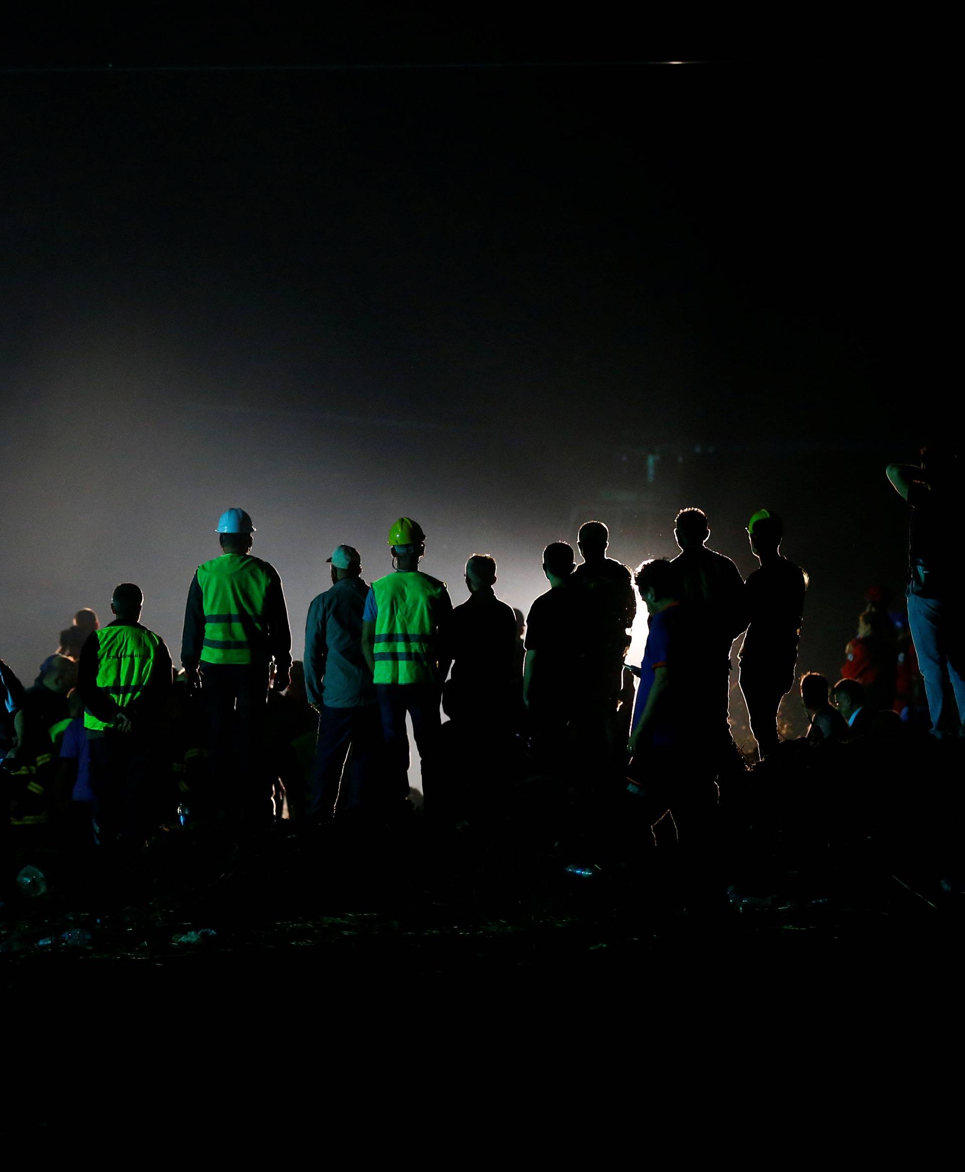 Rescue workers and paramedics work at the site of a train derailment near Corlu in Tekirdag province, Turkey