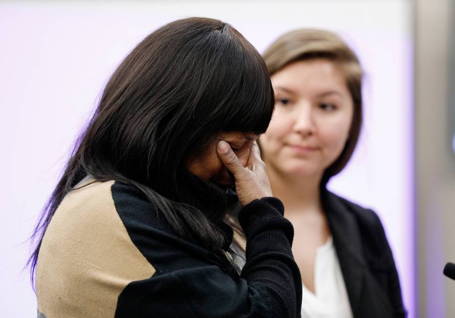 Annette Hill reacts as she delivers a victim impact testimony during a sentencing hearing for Dr. Larry Nassar in Lansing