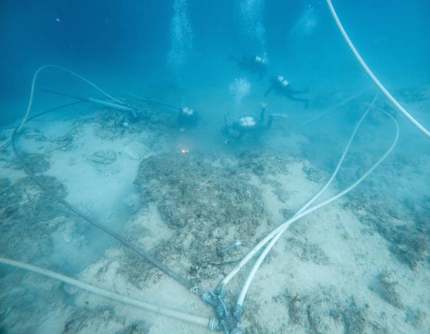 Underwater archaeologists work at a Byzantine shipwreck near Polace on the island of Mljet