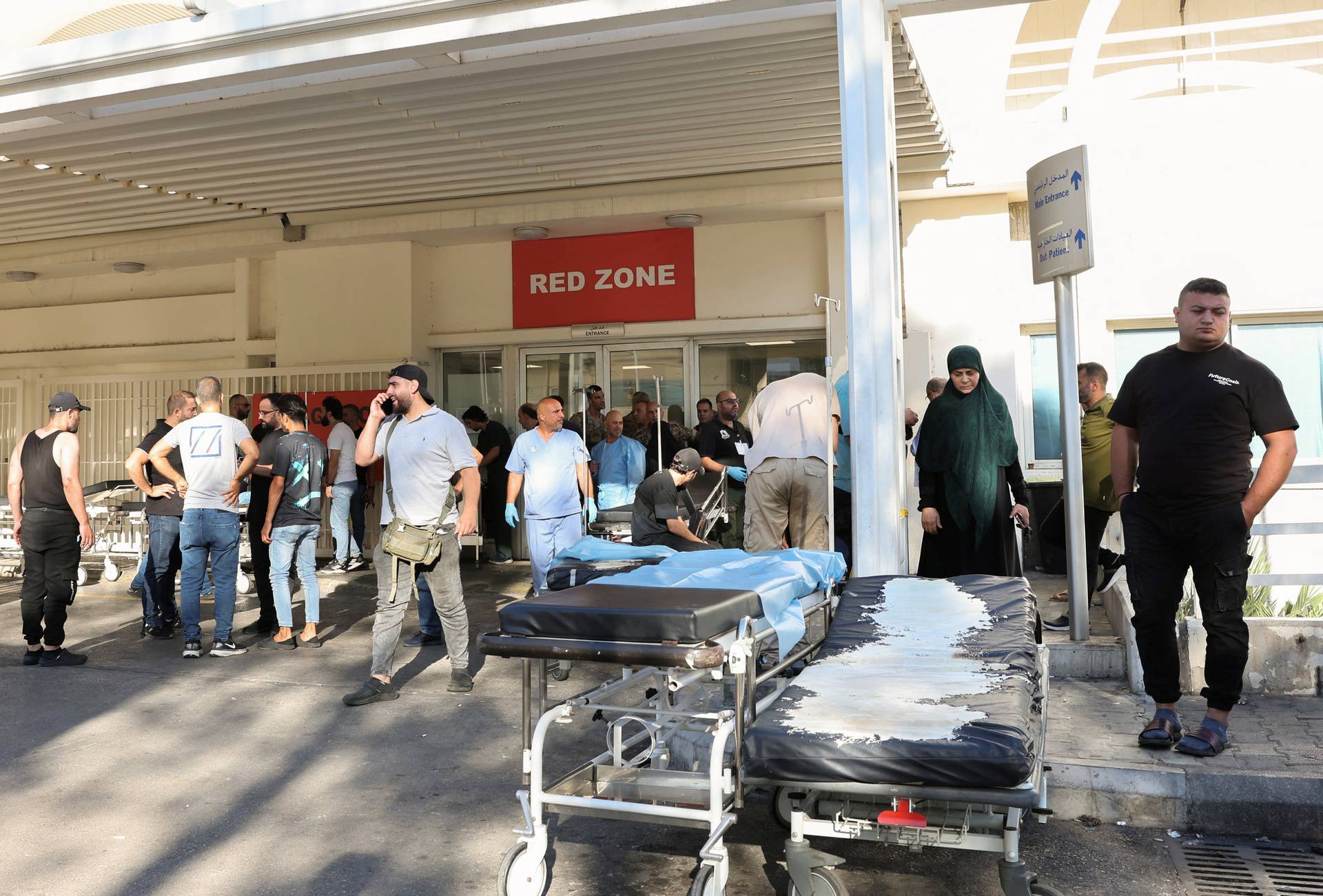 People gather outside a hospital, as hundreds of members of the Lebanese armed group Hezbollah, including fighters and medics, were seriously wounded on Tuesday when the pagers they use to communicate exploded, according to a security source, in Beirut