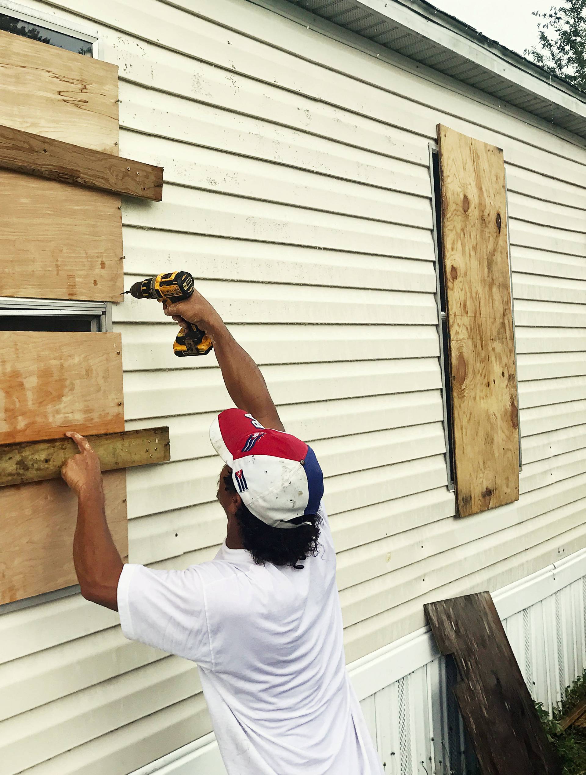 Filomeno Romero, 52, reinforces his mobile home ahead of the approach of Hurricane Irma in Apopka