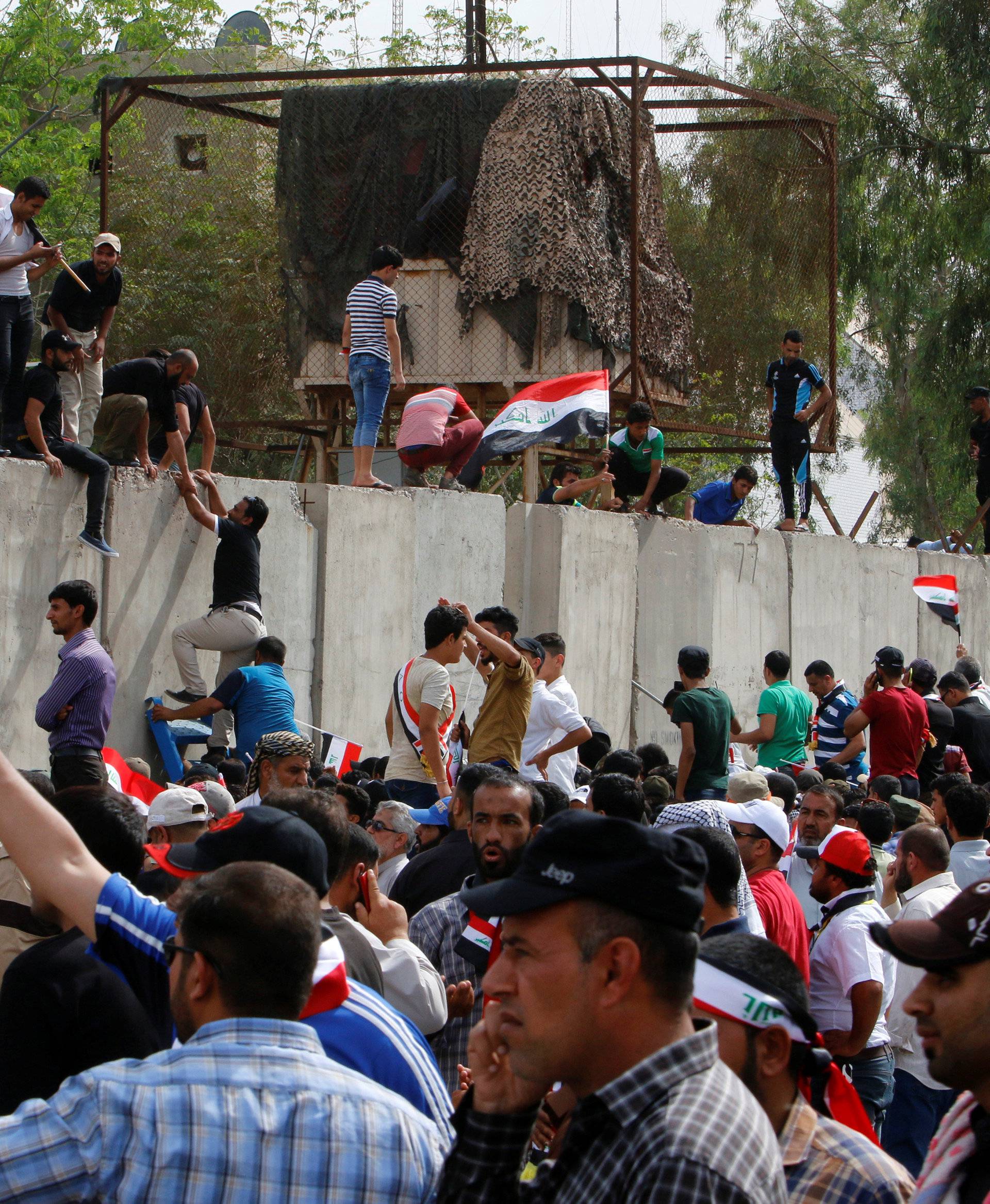 Followers of Iraq's Shi'ite cleric Moqtada al-Sadr storm Baghdad's Green Zone after lawmakers failed to convene for a vote on overhauling the government, in Iraq