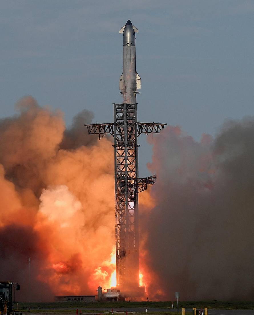 A SpaceX Super Heavy booster carrying the Starship spacecraft lifts off on its 10th test flight