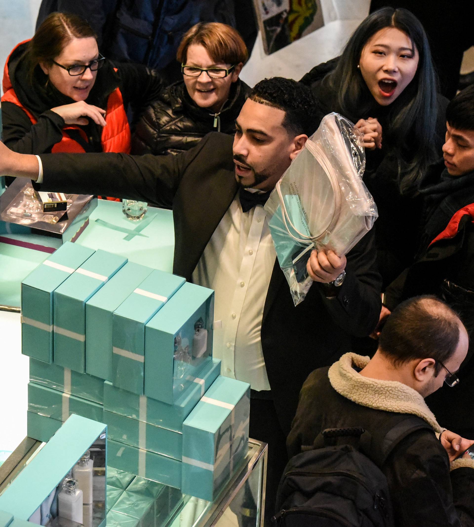 People shop during a Black Friday sales event at Macy's flagship store in New York City