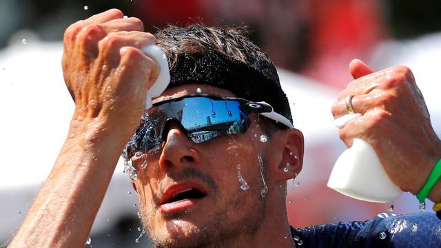 FILE PHOTO: Triathlete Jan Frodeno of Germany tries to cool down on his way to win the Ironman triathlon European Championships in Frankfurt