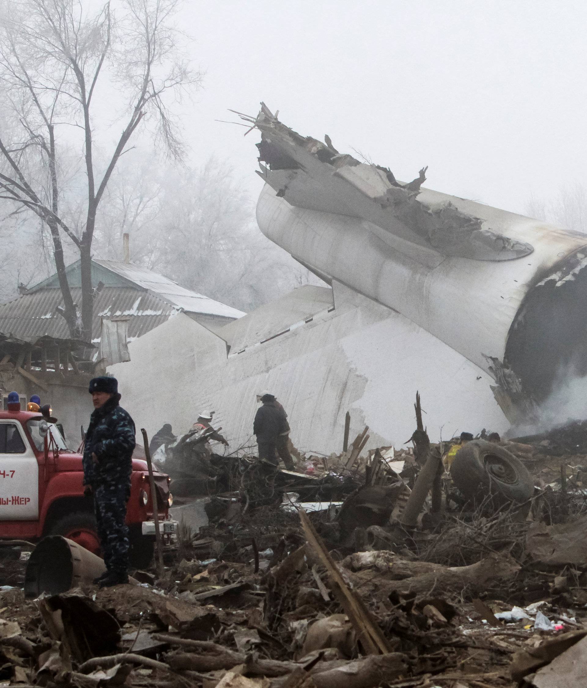 Rescue teams are seen at the crash site of Turkish cargo jet near Kyrgyzstan's Manas airport outside Bishkek