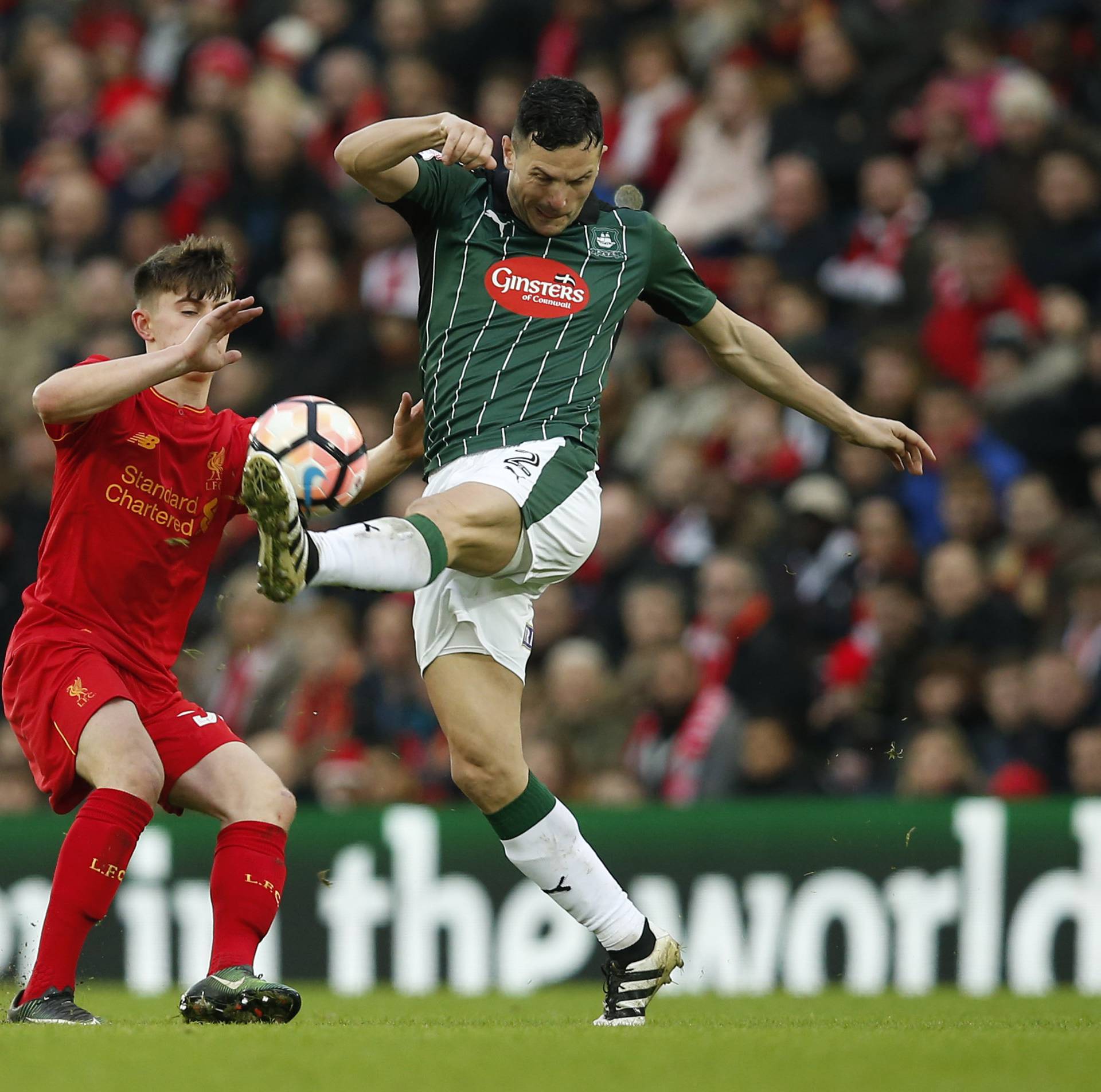 Liverpool's Ben Woodburn in action with Plymouth Argyle's Gary Miller