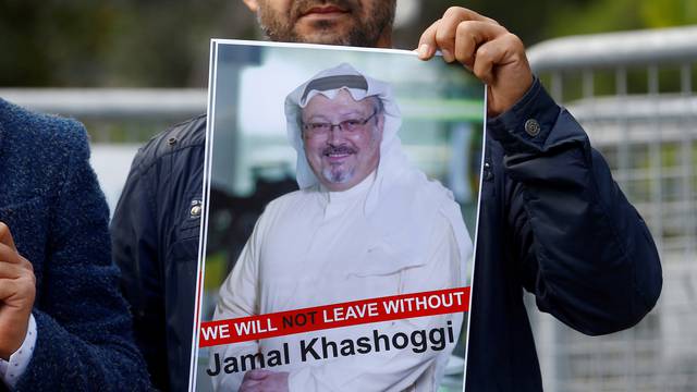 FILE PHOTO: A demonstrator holds picture of Saudi journalist Jamal Khashoggi during a protest in front of Saudi Arabia's consulate in Istanbul