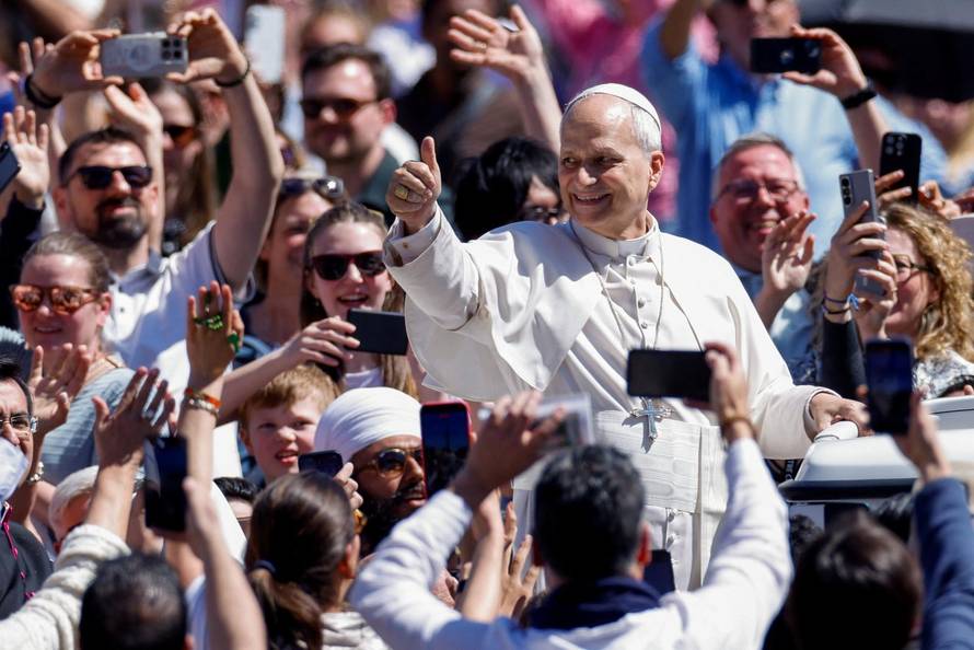 Pope Leo XIV delivers his "Urbi et Orbi" (To the city and the world) message from the main balcony of St. Peter's Basilica