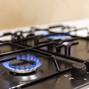 Gas burner on black modern kitchen stove