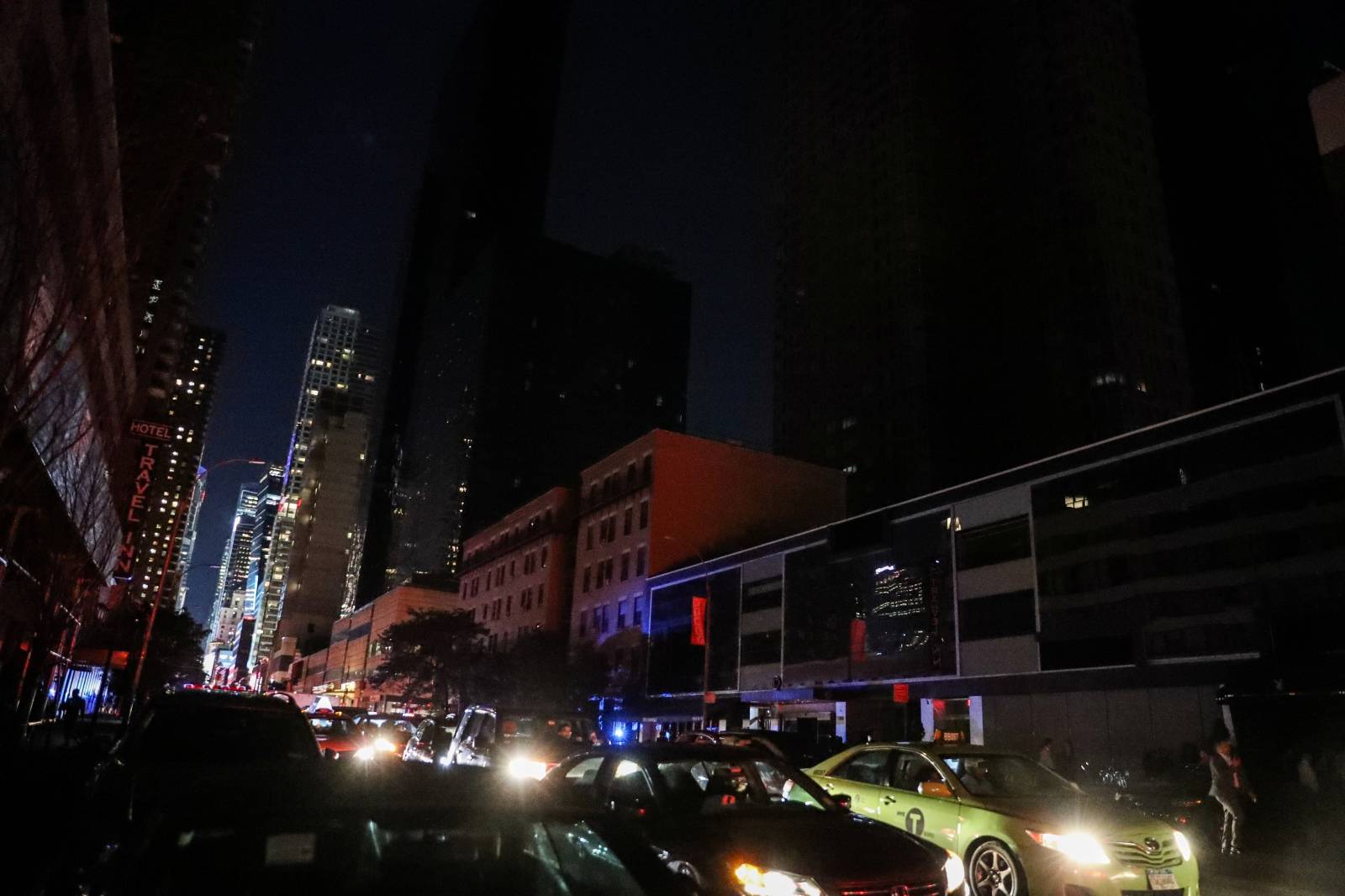 Residential buildings light out near Times Square area, as a blackout affects buildings and traffic during widespread power outages in the Manhattan borough of New York