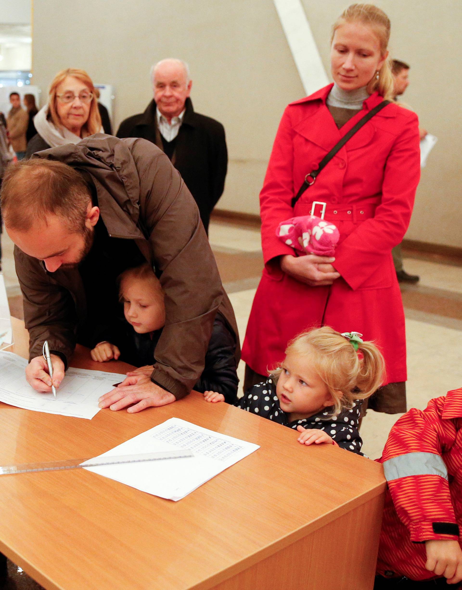 People visit polling station during parliamentary election in Moscow
