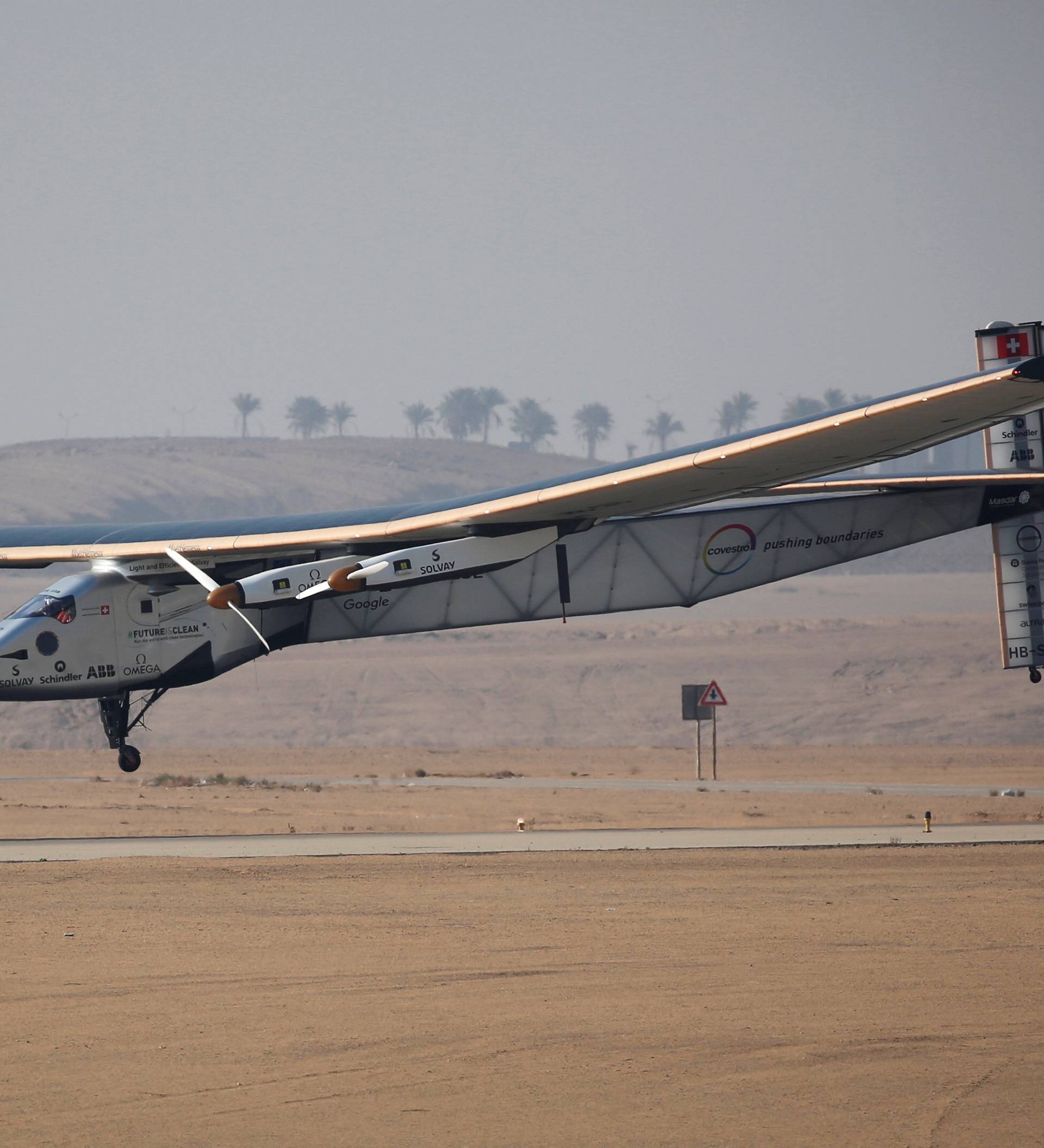 Solar Impulse 2, a solar powered plane piloted by Swiss aviator Andre Borschberg, is seen as it prepares to land at Cairo Airport