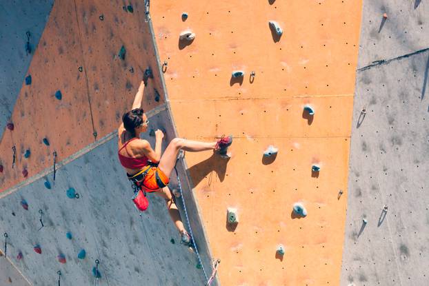 Training,At,The,City,Climbing,Gym.,A,Strong,Woman,Climbs