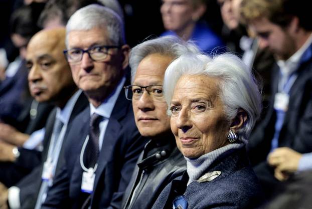 FILE PHOTO: People attend the World Economic Forum in Davos