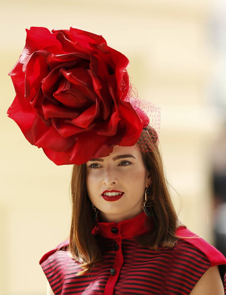 Britain Horse Racing Ladies Day Racegoer wears hat