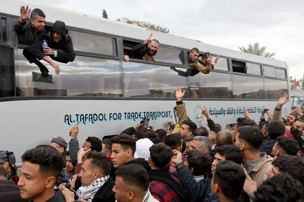 Freed Palestinian prisoners are greeted after being released from an Israeli jail, as part of a hostages-prisoners swap and a ceasefire deal in Gaza between Hamas and Israel, in Khan Younis