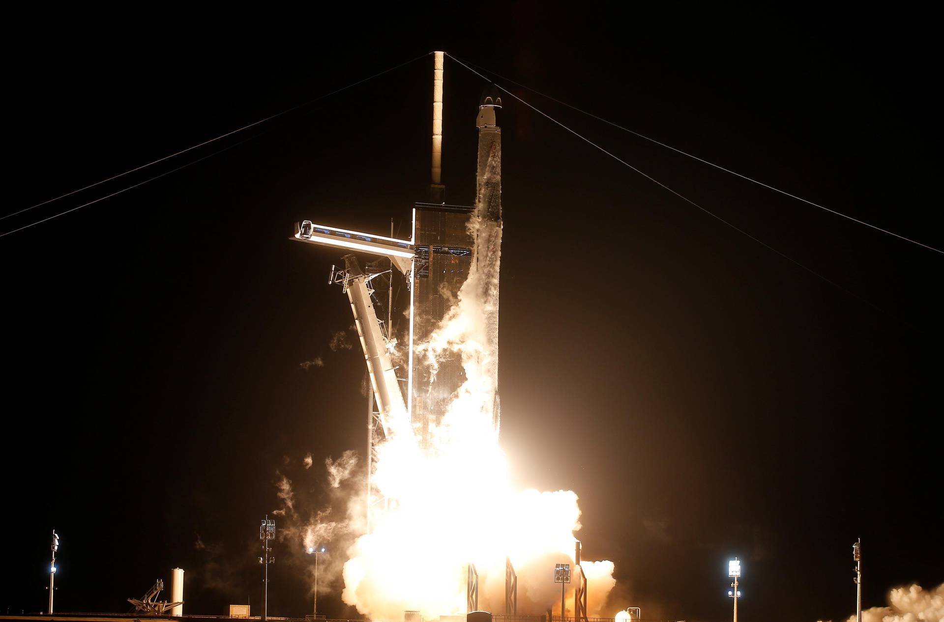 A SpaceX Falcon 9 rocket, with the Crew Dragon capsule, is launched carrying three NASA and one ESA astronauts