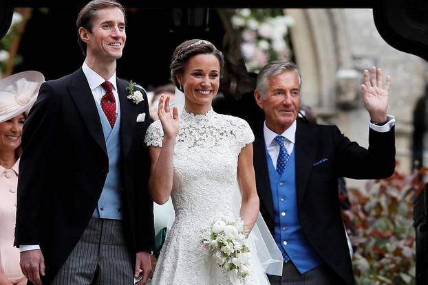 FILE PHOTO: Pippa Middleton and James Matthews pose for photographs after their wedding at St Mark's Church in Englefield