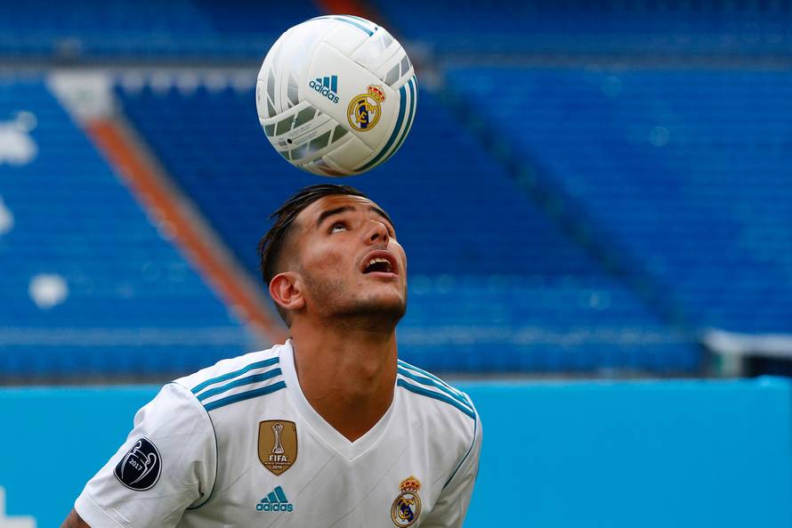 Real Madrid's new player Theo Hernandez heads the ball during his presentation at the Santiago Bernabeu Stadium in Madrid