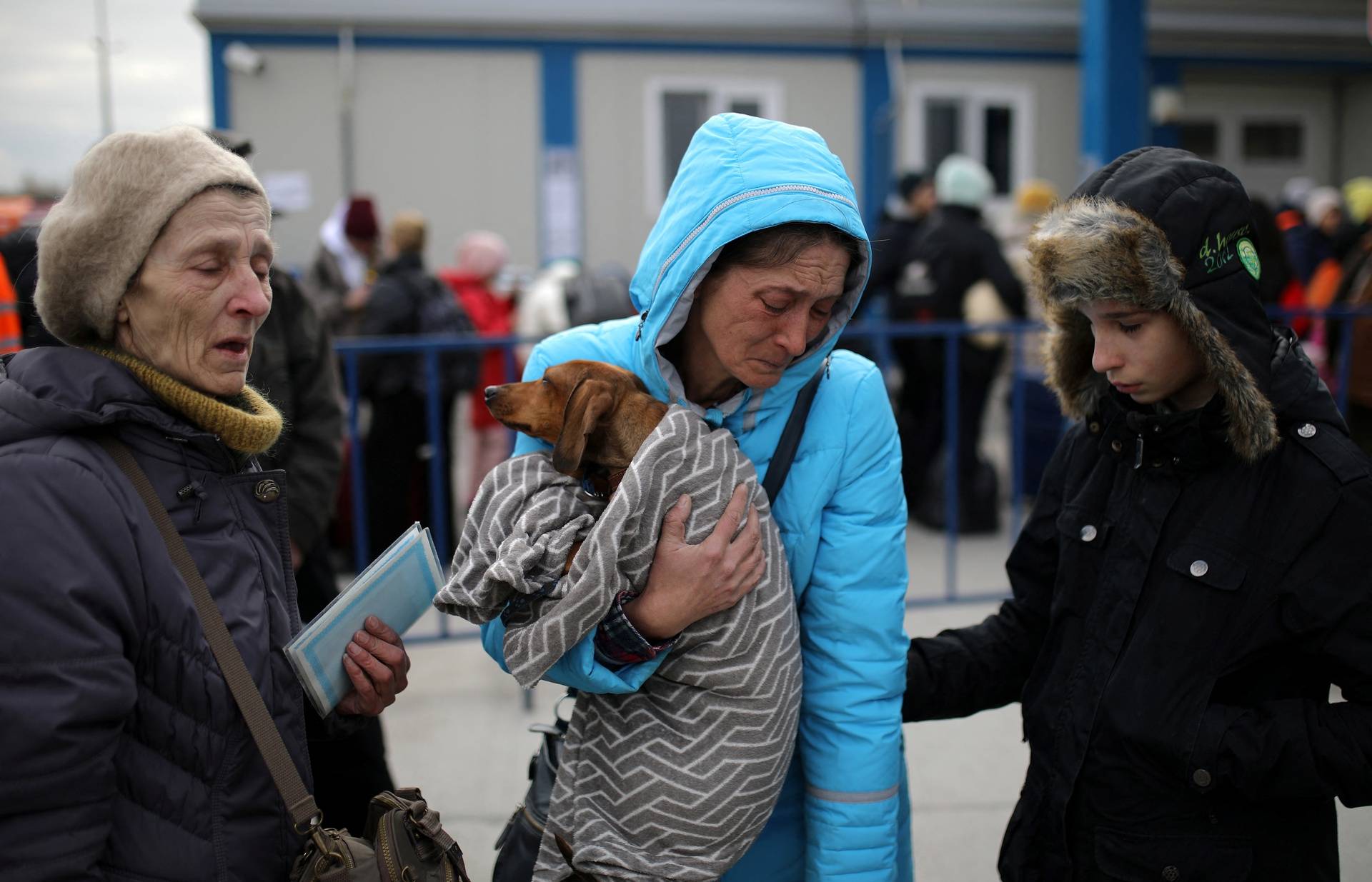 People flee from Ukraine to Romania at the border crossing in Isaccea