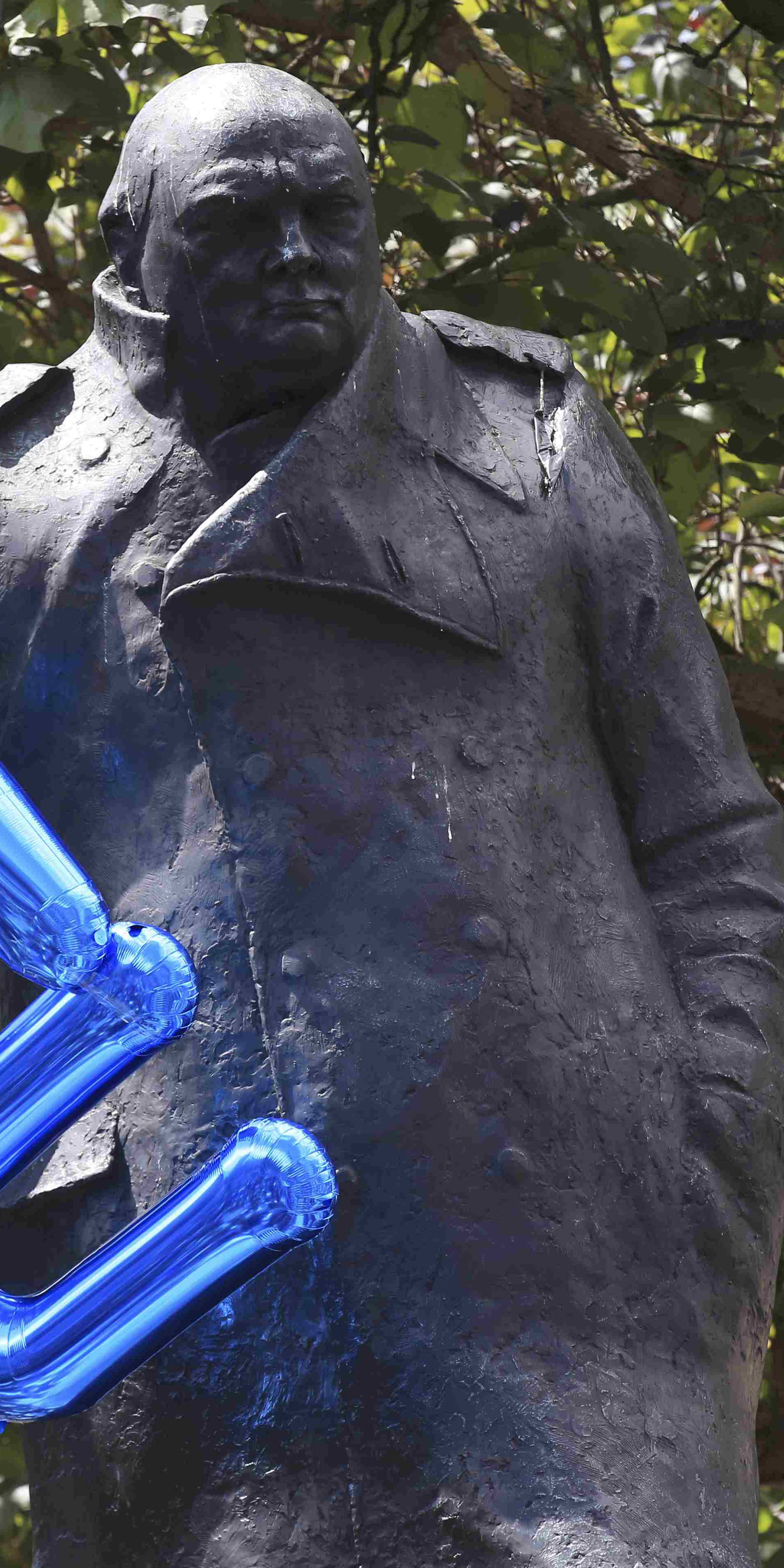 An EU balloon is tied to the Winston Churchill statue in Parliament Square during a 'March for Europe' demonstration against Britain's decision to leave the European Union, central London