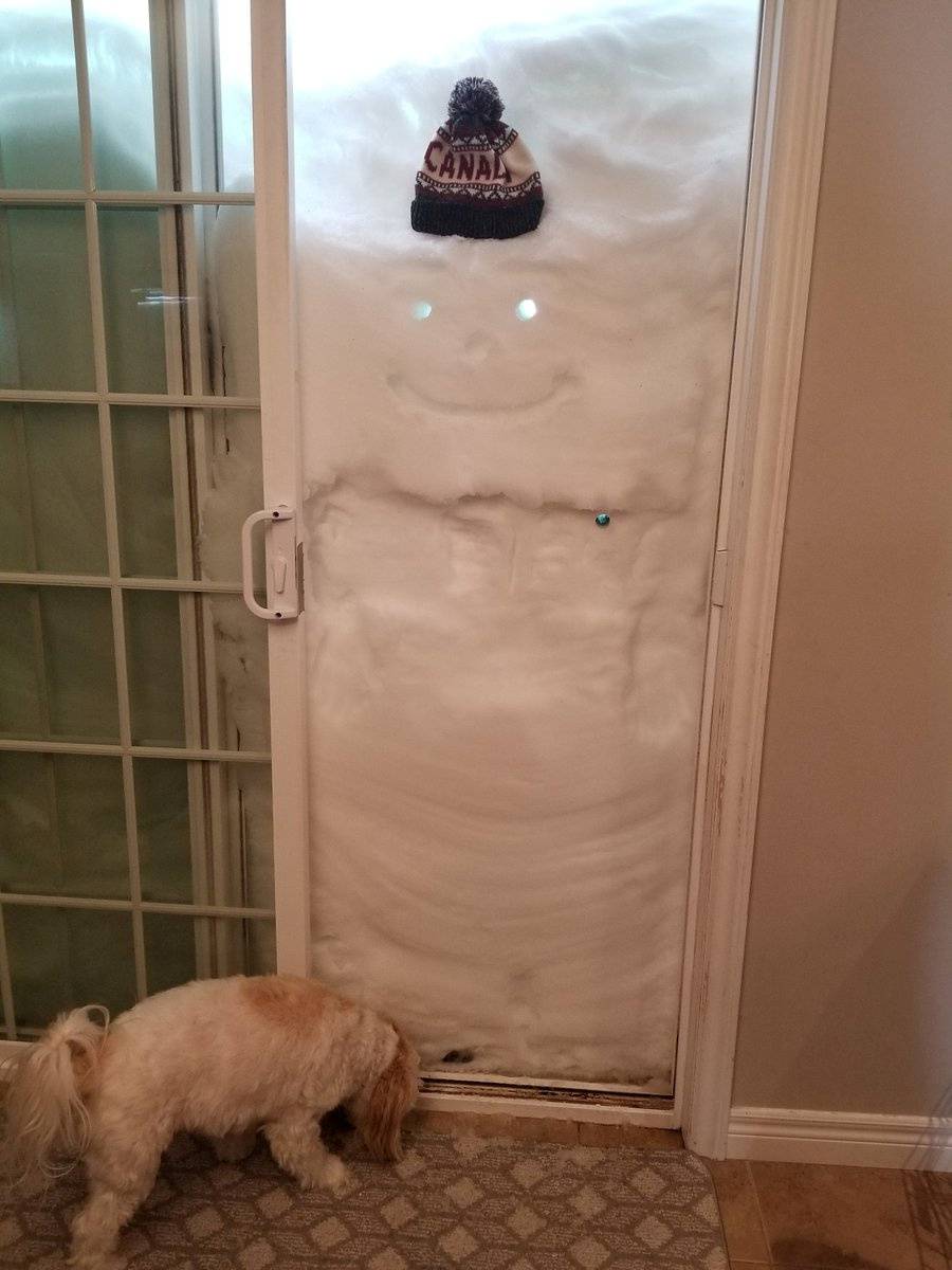 Snow covers the entrance to a house in Paradise