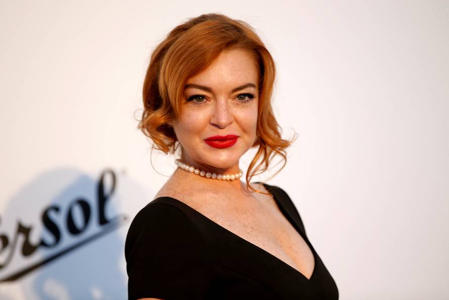 FILE PHOTO: Lindsay Lohan poses upon arrival at the 70th Cannes Film Festival The amfAR's Cinema Against AIDS 2017 event in Antibes