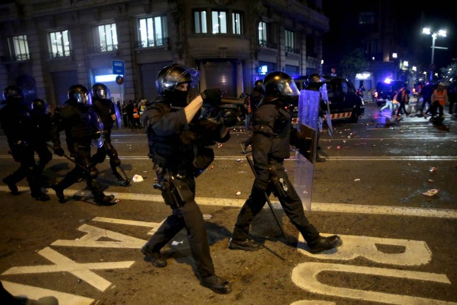 Police charge against protesters in the streets of Barcelona