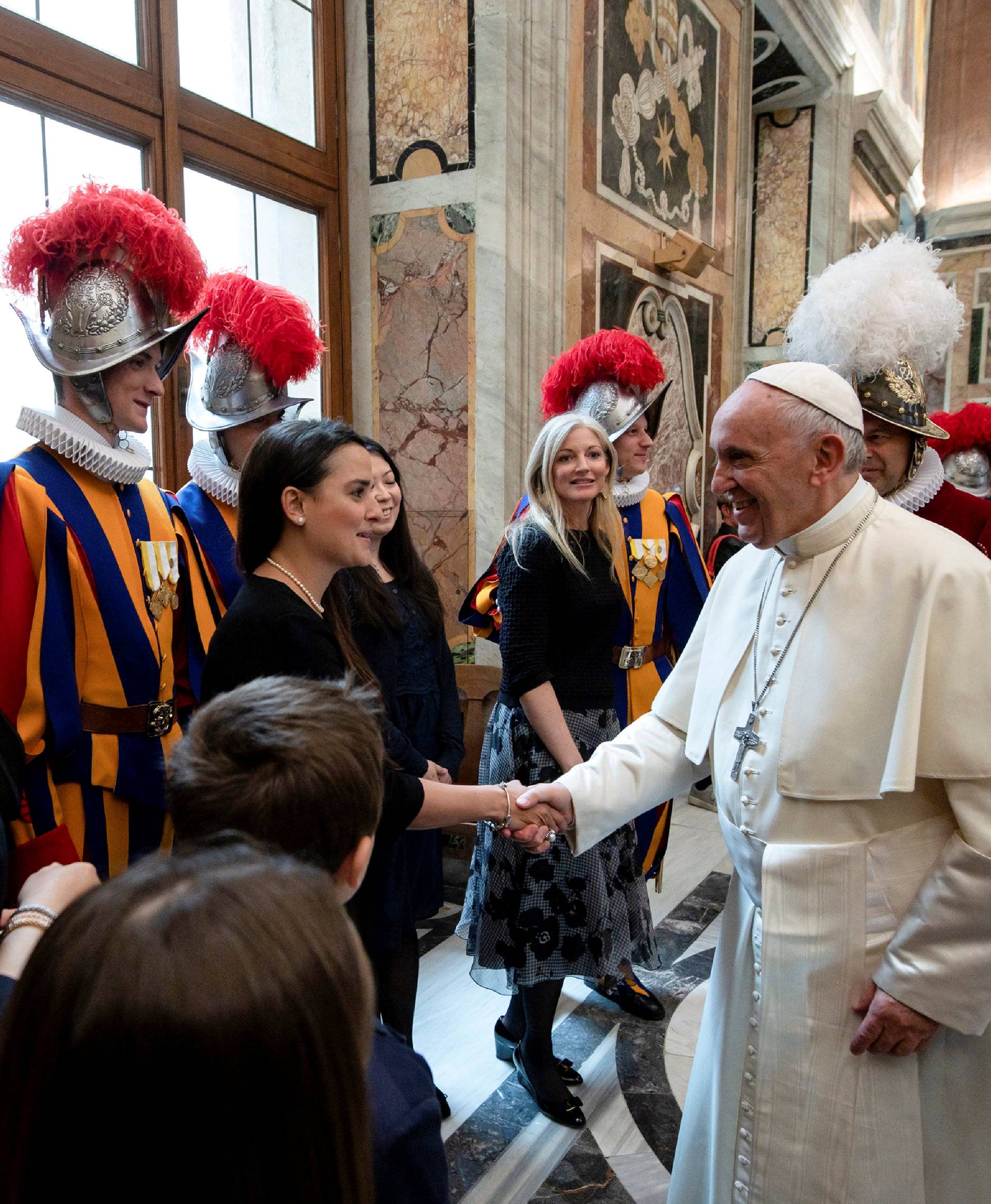 Pope Francis greets relatives of Swiss guards the day ahead of their swearing-in ceremony at the Vatican