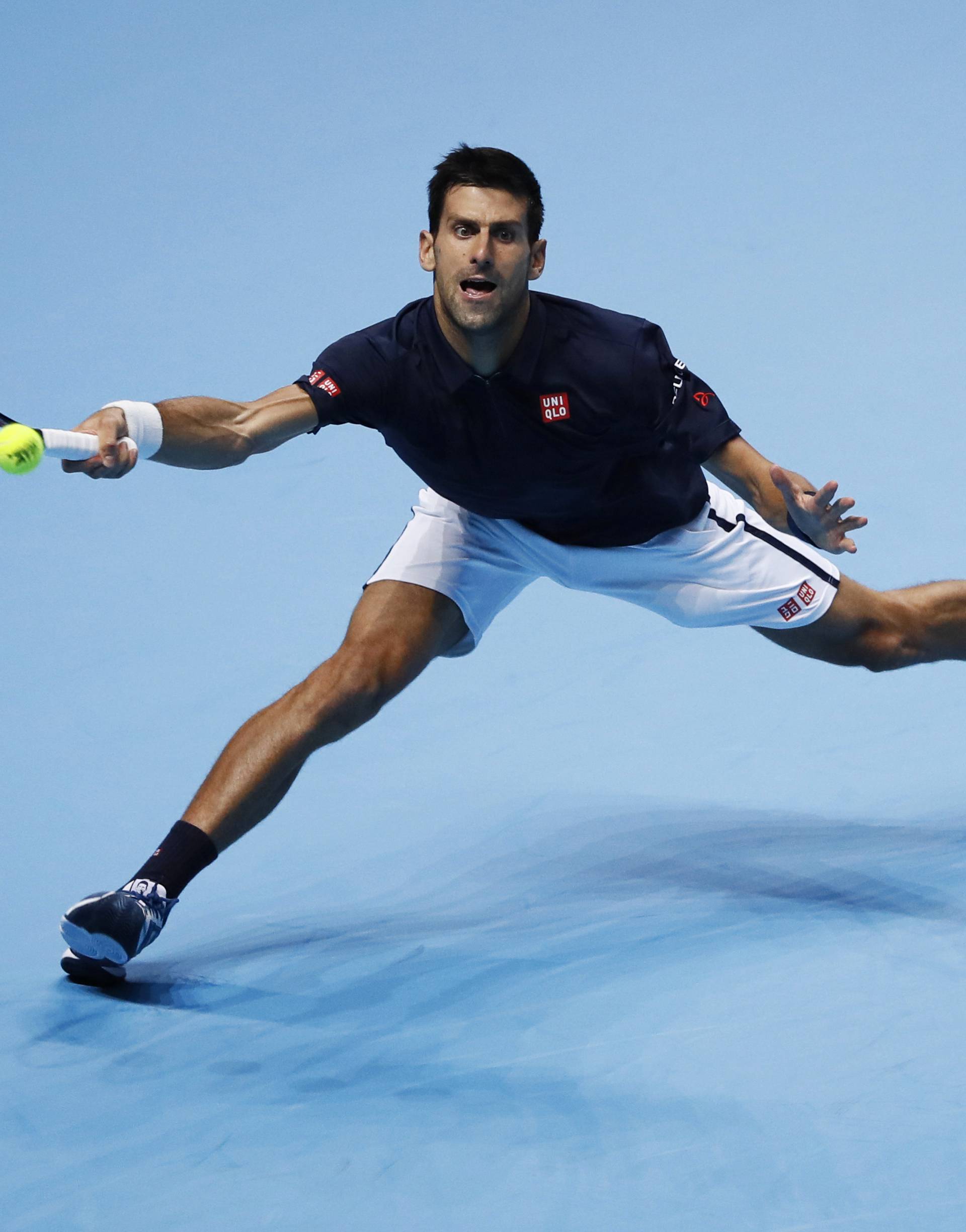 Serbia's Novak Djokovic in action during his round robin match with Canada's Milos Raonic
