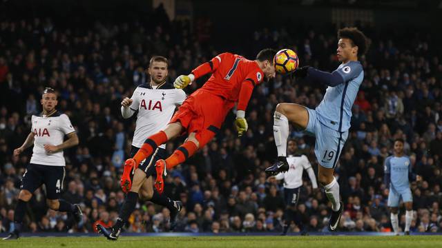 Manchester City's Leroy Sane in action with Tottenham's Hugo Lloris before scoring their first goal