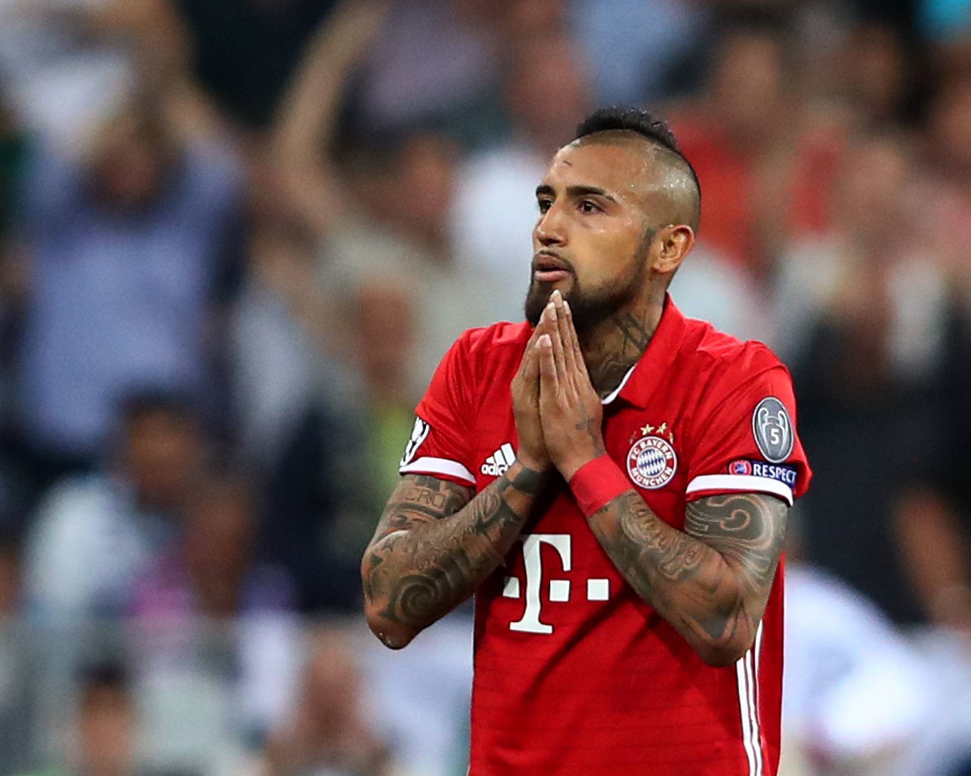 Bayern Munich's Arturo Vidal looks dejected after being sent off