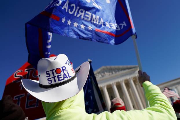People participate in a "Stop the Steal" protest outside the U.S. Supreme Court in support of U.S. President Donald Trump in Washington