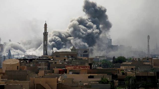FILE PHOTO: Smoke rises from an airstrike during a battle between Iraqi forces and Islamic State militants in western Mosul