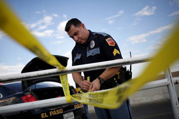 A police cordon is seen after a mass shooting at a Walmart in El Paso