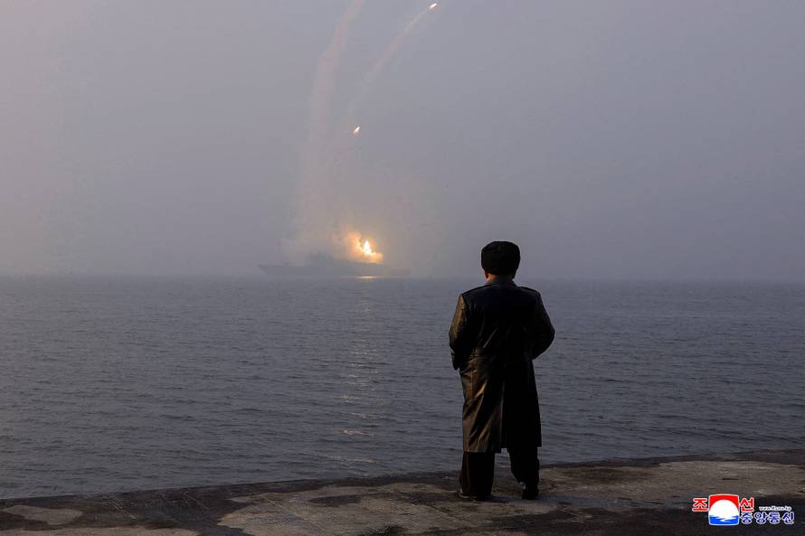 North Korean leader Kim Jong Un oversees a missile test launch conducted by the Choe Hyon naval destroyer during his visit to inspect the vessel at the Nampho Shipyard