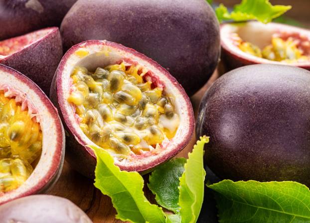 Ripe,Passion,Fruits,With,Passion,Fruit,Seeds,And,Passionfruit,Leaves
