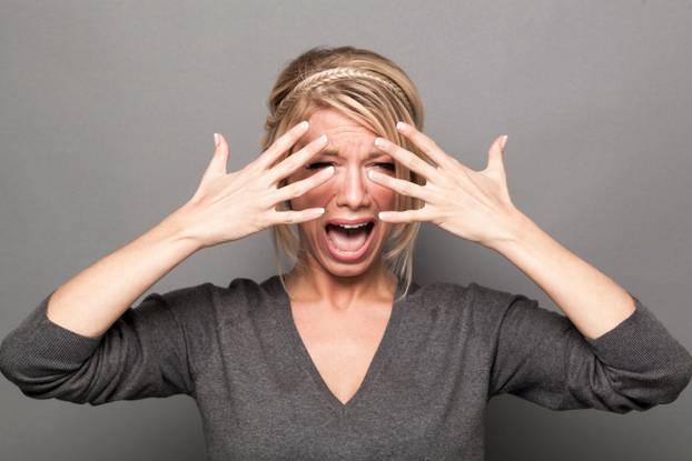 extrovert beautiful woman expressing her pain and sorrow with anger