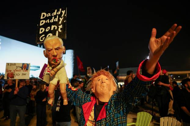 Israelis take part in an anti-war protest in Tel Aviv