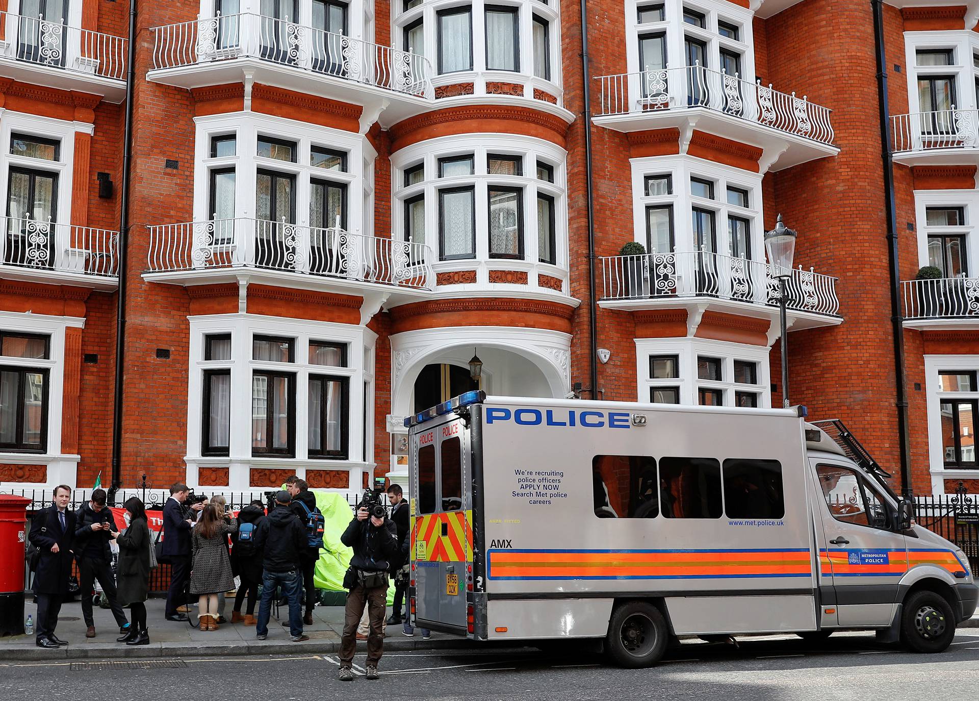 A police van is seen outside the Ecuadorian embassy after WikiLeaks founder Julian Assange was arrested by British police in London