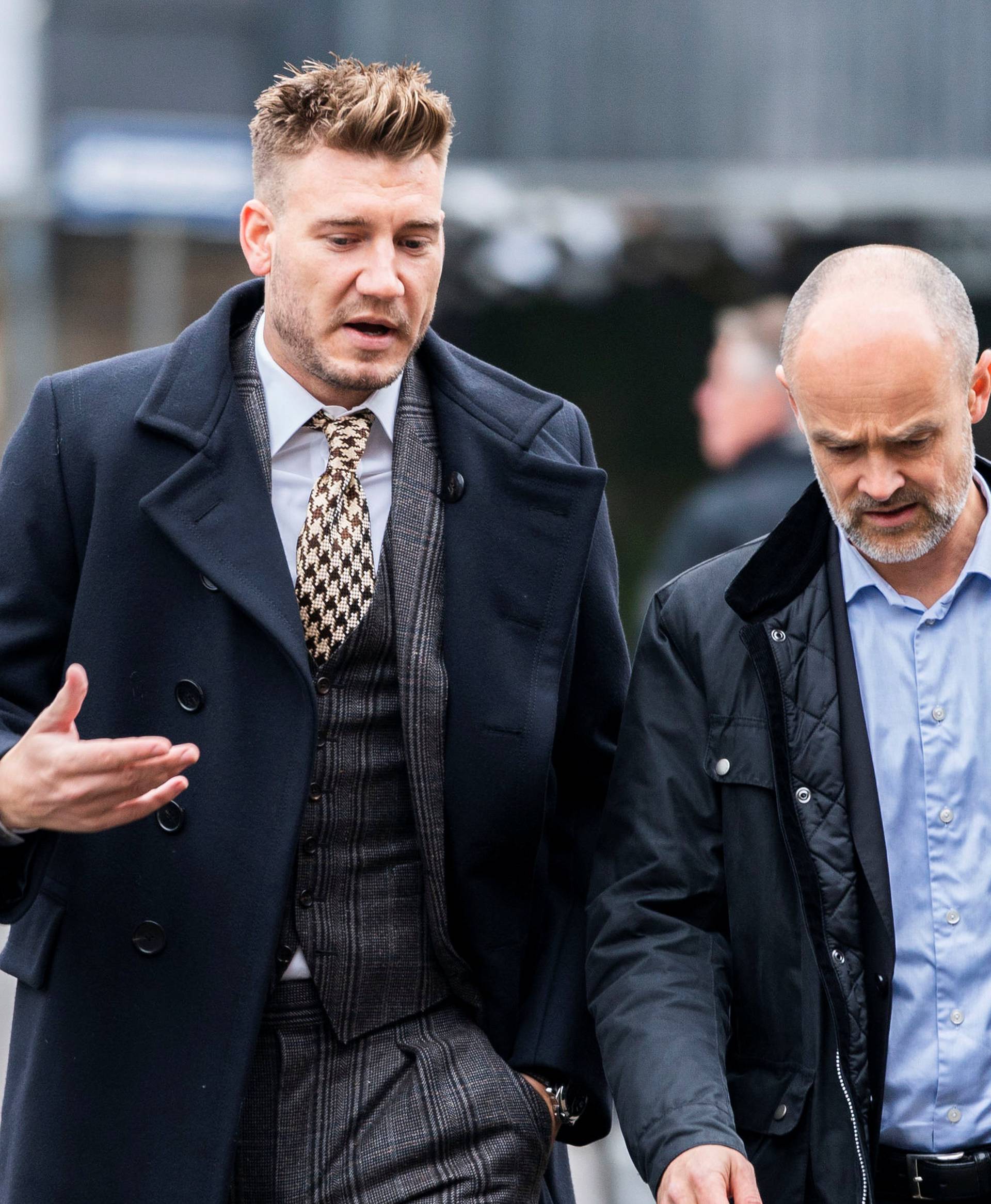 Denmark striker Nicklas Bendtner and lawyer Anders Nemeth arrive at the Copenhagen City Council