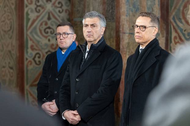 Prayer for peace inside the St. Sophia's Cathedral on the fourth anniversary of Russia's full-scale invasion, in Kyiv